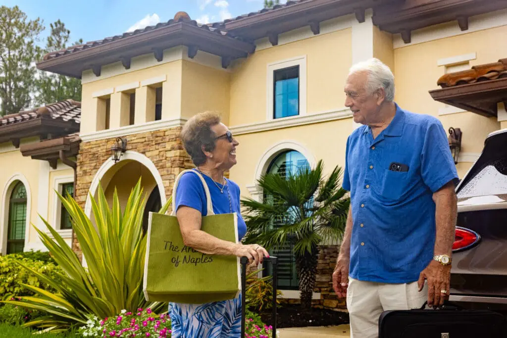 Arlington of Naples couple outside of estate home
