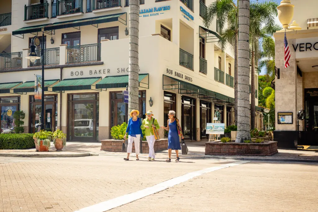 3 senior women walking around a shopping center, one of the best Things to Do in Naples FL, for seniors,
