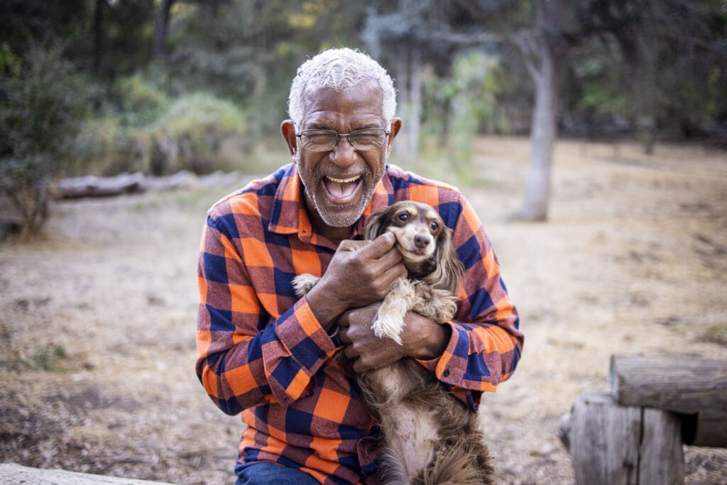 Senior Man with Long Haired Dachshund