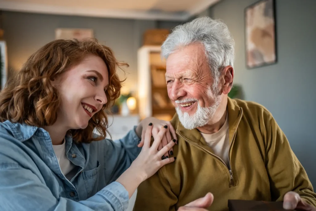 adult daughter and her dad discuss senior memory care in Naples